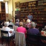 Caroline Bendix explaining the importance of book conservation and how to carry out simple repairs which can make all the difference to both the appearance and the durability of the book