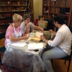 Showing a Library Friend how to repair her book